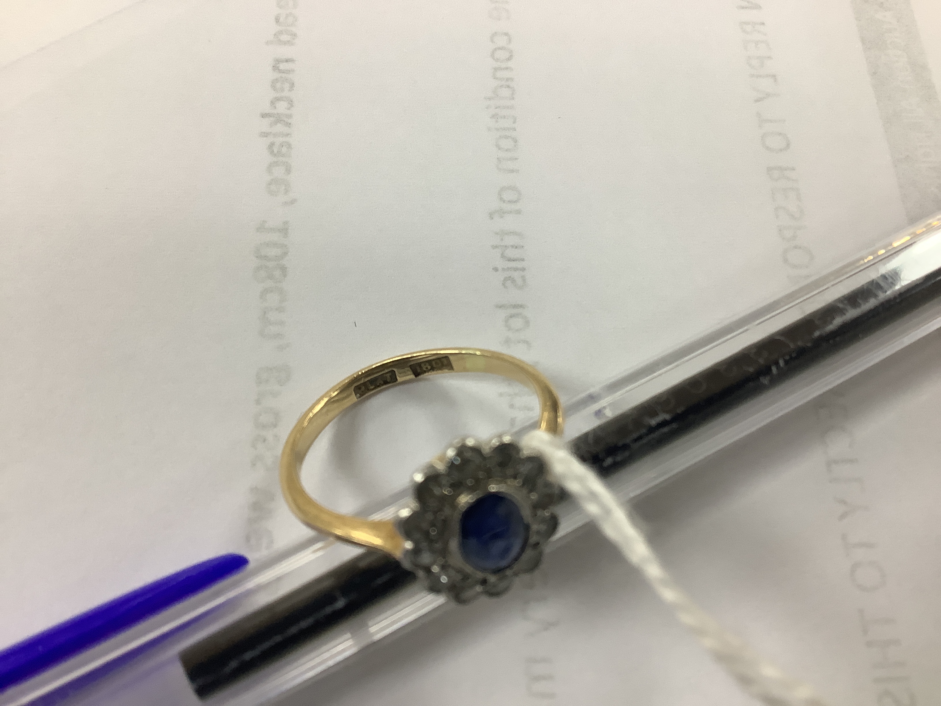 An early to mid 20th century 18ct and plat. sapphire and diamond set oval cluster ring, size L, gross weight 2.5 grams.